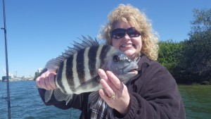 Tampa fishing charters client Kaire with a sheepshead